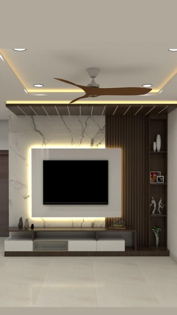 modern living room with white walls and marble flooring, ceiling fan and tv on the wall