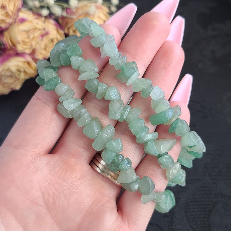 "**These bracelets are already made, so we are not able to customize sizes. Please verify your wrist size before ordering.** To see our other crystal Bracelets, click here: https://www.etsy.com/shop/BeautifulVibeCrystal?section_id=36836813 Approximate Dimensions: Bead: 5 - 8 mm Chip/Nugget Bracelet Fits: 6 - 7.5\" Wrist 1 inch = 25.4 mm 1 pound = 453.6 grams Aventurine is known as the \"Stone of Opportunity,\" and is believed to be the luckiest of all crystals. It can be especially useful in man Crystal Bracelet Collection, Chipped Crystal Bracelet, Green Crystal Bracelet, Green Crystal Beaded Bracelets, Handmade Green Crystal Bracelet For Party, Aventurine Bracelet, Aventurine Gemstone Crystal Bracelet Gift, Handmade Aventurine Crystal Bracelet Gift, Handmade Green Crystal Bracelets