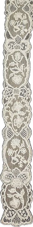 an intricately designed rug is shown in grey and white colors, on a white background