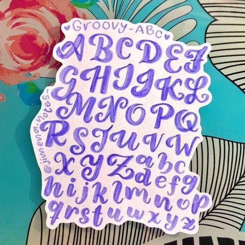 a sticker that has some type of writing on it with flowers in the background