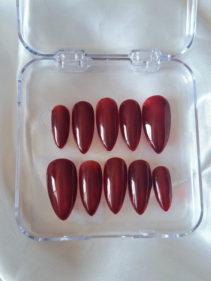 *SETS MAY VARY DEPENDING ON LENGTH* This set of classic, simple, red stiletto shaped, medium length press on Nails is re-useable and high quality.  If you like gothic vibes and red stiletto nails this is the perfect set for you!  unique and stands out, this style can go with almost any alternative  outfit. The Nails are Gel based nails with gems and Nail art added. They are strong and druable and can last up to 2 weeks with proper, nail preparation, application and aftercare. You can also, take Nails With Gems, Red Stiletto Nails, Red Stilettos, Acrylic Press On Nails, Cuticle Remover, Nail Buffer, Cuticle Oil, Alternative Outfits, Stiletto Nails