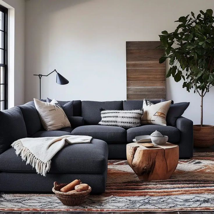 a living room filled with furniture and a potted plant