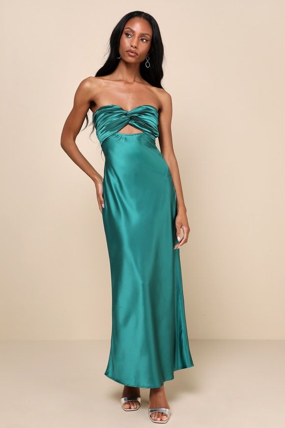 You'll be looking especially extraordinary in the Lulus So Rare Emerald Green Satin Strapless Twist-Front Midi Dress! Glossy woven satin shapes this head-turning dress that falls from a strapless, sweetheart neckline (with hidden no-slip strips) into a pleated, twist-front bodice that creates a flirty cutout. The high, fitted waist sits atop a figure-skimming slip skirt that finishes at a chic midi hem. Turn around to reveal two elasticized straps that lay across the otherwise open-back design. Open Back Wedding Guest Dress, Pre-draped Satin Strapless Cocktail Dress, Pre-draped Satin Strapless Dress For Gala, Strapless Satin Finish Cocktail Evening Dress, Green Satin Strapless Cocktail Dress, Green Satin Strapless Dress For Cocktail, Silk Strapless Floor-length Cocktail Dress, Strapless Silk Maxi Dress With Ruched Details, Silk Strapless Dress With Fitted Bodice