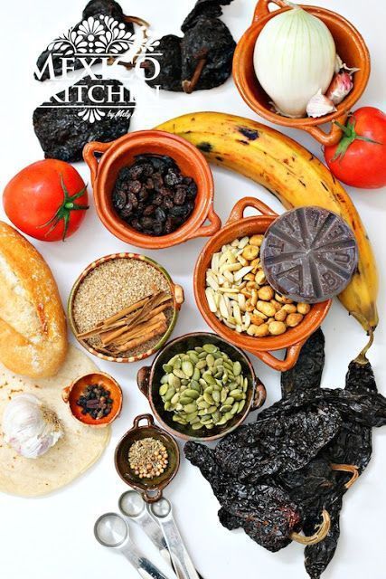 an assortment of food is displayed on a white surface