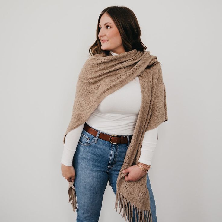 Stay warm in style with this Prince Paisley Shawl! Crafted from 100% soft, high end acrylic, this cool and cozy shawl adds a touch of class to any look. It's perfect for a day in town, brunch with the girls, or on a cozy night in. Fringe and a paisley design? It's a winning combo! Available in 2 colors including black and taupe. Measurements: 37"W x 34"H Material: 100% Acrylic Cozy Shawl, Paisley Shawl, Cozy Night, Hair Studio, Outerwear Vest, Hot Mess, Paisley Design, Dress Gift, Touch Of Class