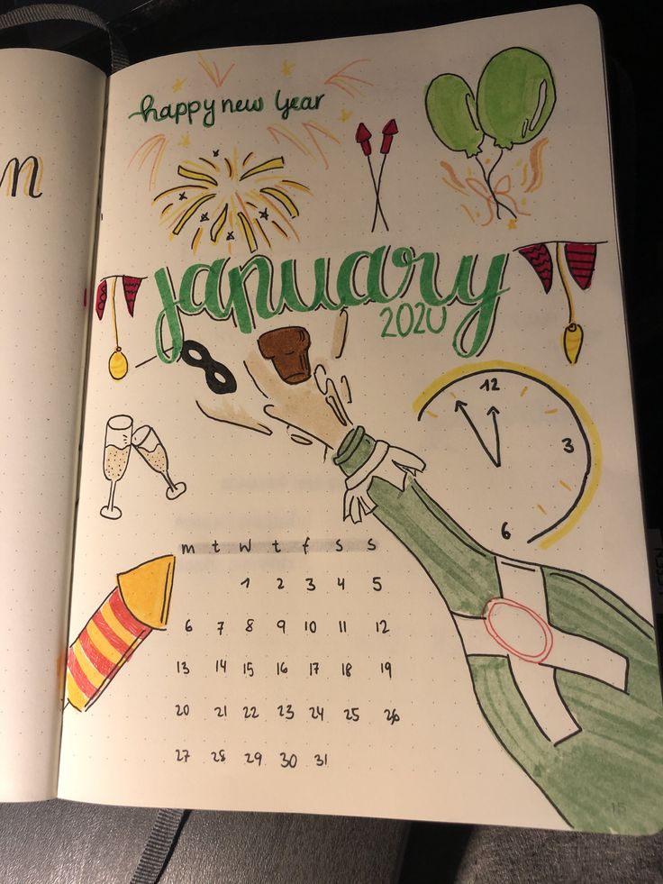 an open notebook with a drawing of a person holding a clock and celebrating the new year