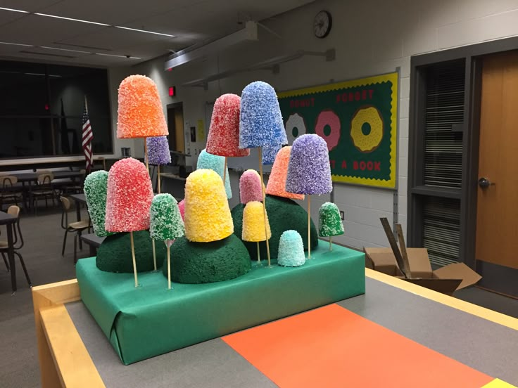 there are many different colored candies on the table in this classroom setting, and they look like they have been made out of candy