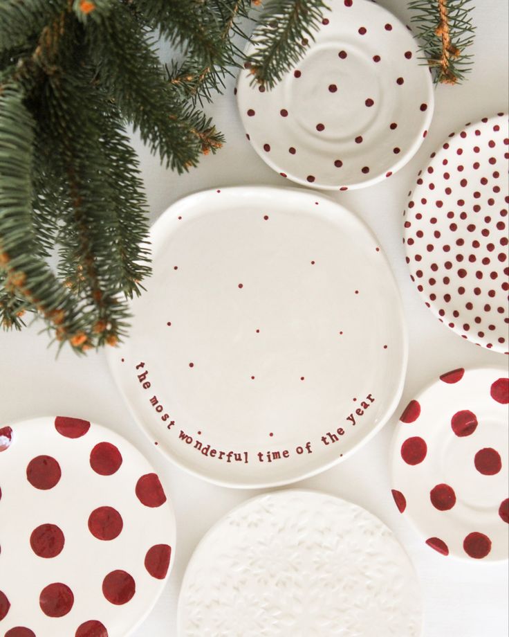 red and white polka dot plates with words on them