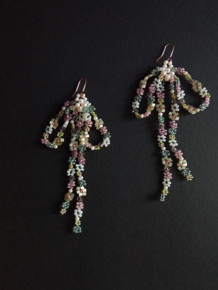 This is bow earrings made of seed beads, pearls and glass beads. They are neatly handwoven in feminine design. the all materials that I use are of the high quality (natural stones or first grade beads)  all pieces in my store are neatly handcrafted by me  ready to ship for 1-3 days worldwide free shipping (delivery time US -10-20 days, Europe 14-24days, other 14-30days)  I represent a small business and items are limited I use cute handmade eco tags made from recycled paper in the packaging, i Jewelry Y2k, Gold Hooks, Earrings Bead, Pearl Bow, Women Aesthetic, Dope Jewelry, Handmade Beaded Jewelry, Bow Earrings, Feminine Design