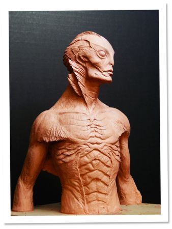 a clay sculpture of a man's torso and chest