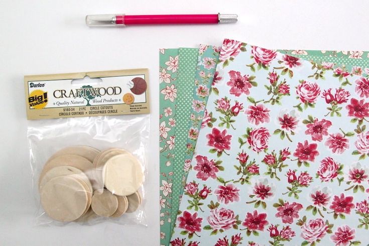 the contents of a craft kit including buttons and paper