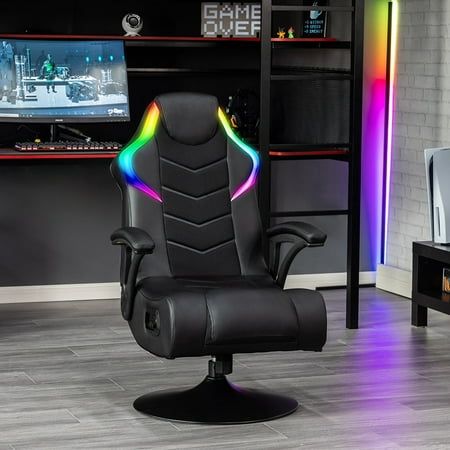 a black office chair sitting in front of a computer desk with a rainbow light on it