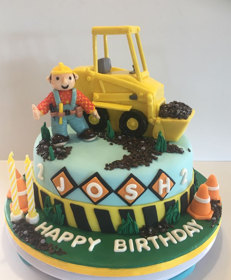 a birthday cake with a construction theme on it