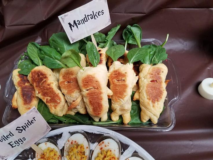 several trays filled with food on top of a table