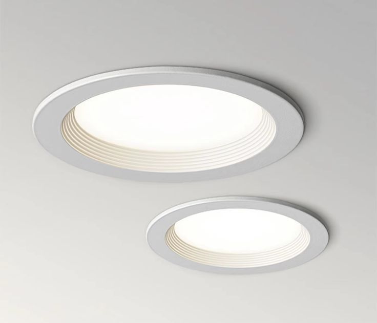 two circular lights are shown on the ceiling