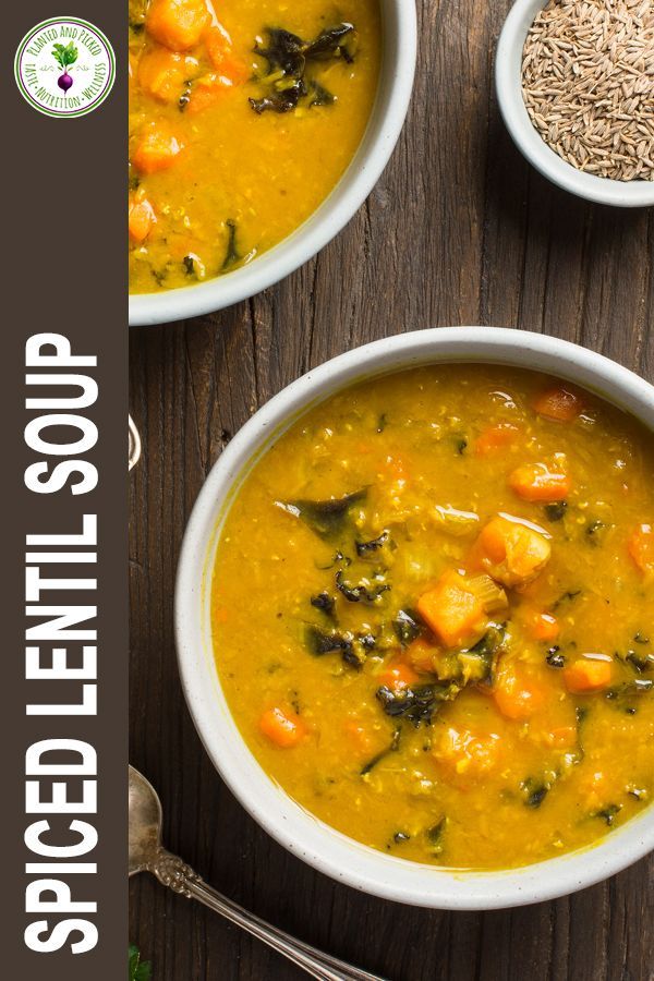 two bowls filled with soup on top of a wooden table