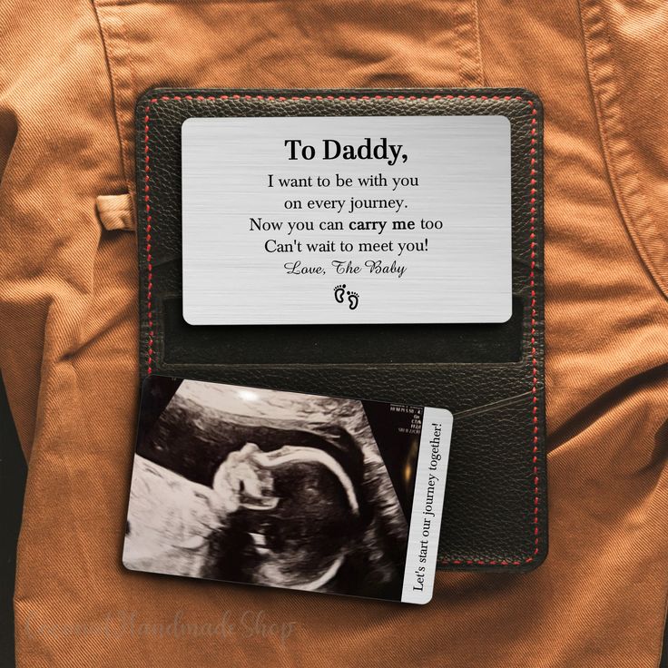 a wallet with a card attached to it that says, to daddy i want to be with you on every journey