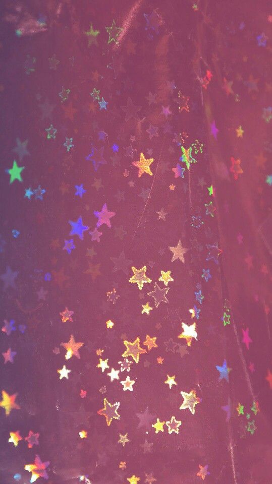 there are many stars on the wall and one is pink, blue, yellow or red