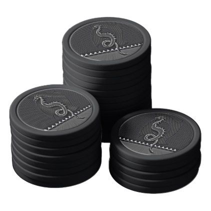 four black plastic coasters with silver thread on the top and one has an image of a snake