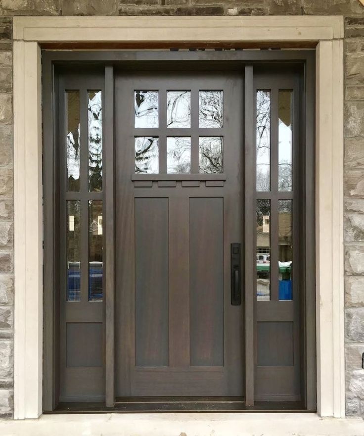 the front door to a house with two sidelights on each side and one side