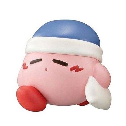 a pink toy with a blue cap on it's head and nose is laying down