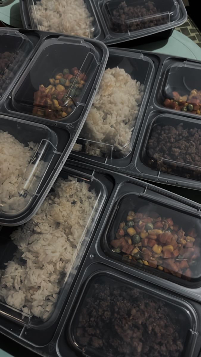 several plastic containers filled with food on top of a table