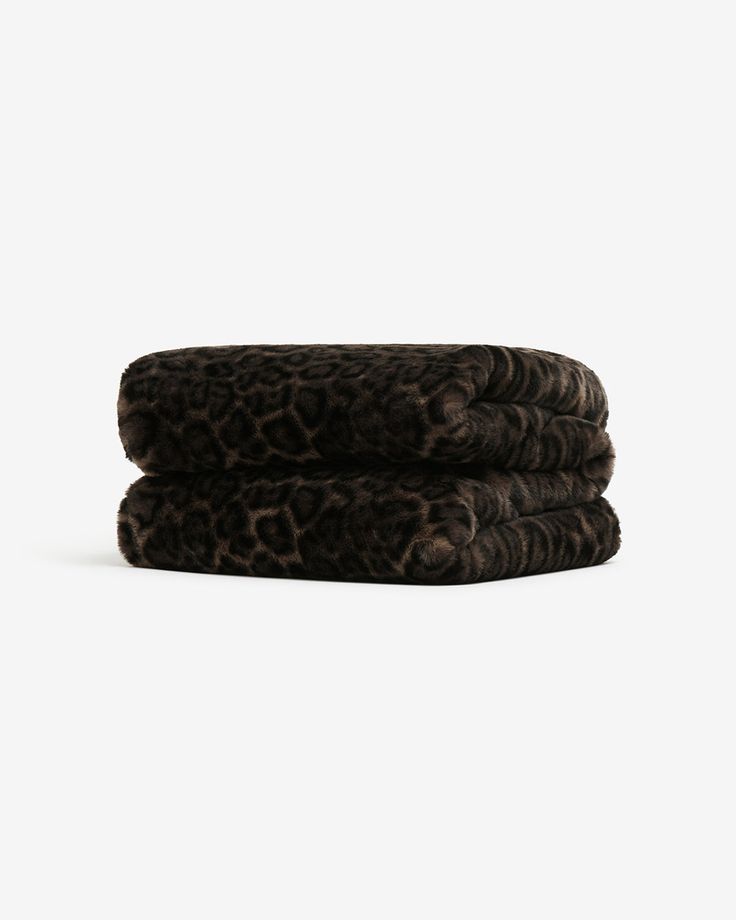 three leopard print towels stacked on top of each other