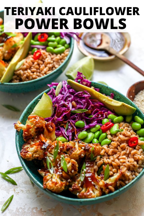 two bowls filled with rice, meat and veggies on top of a table