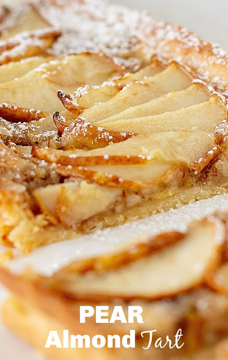 a close up of food on a plate with words overlay that reads pear almond tart