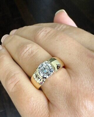 a woman's hand with a ring on it and a diamond in the middle