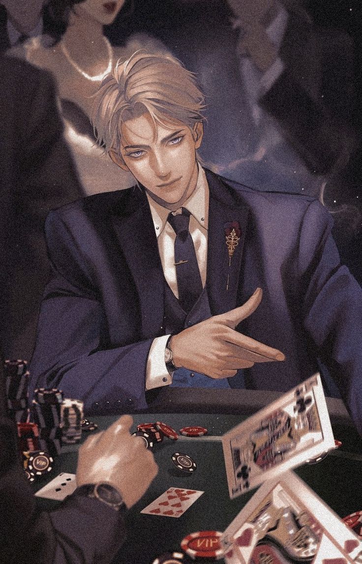 a man in a suit sitting at a table with cards