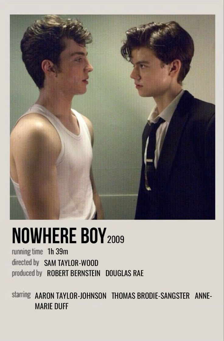 two men standing next to each other in front of a white sign that says nowhere boy 2009