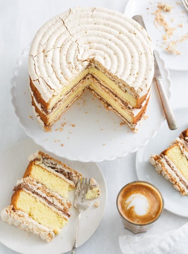 there is a cake on the table with two slices cut out and ready to be eaten