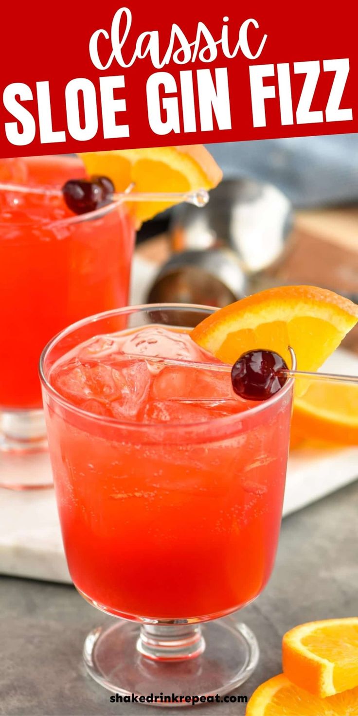 the classic sloe gin fizz is garnished with orange slices and cherries