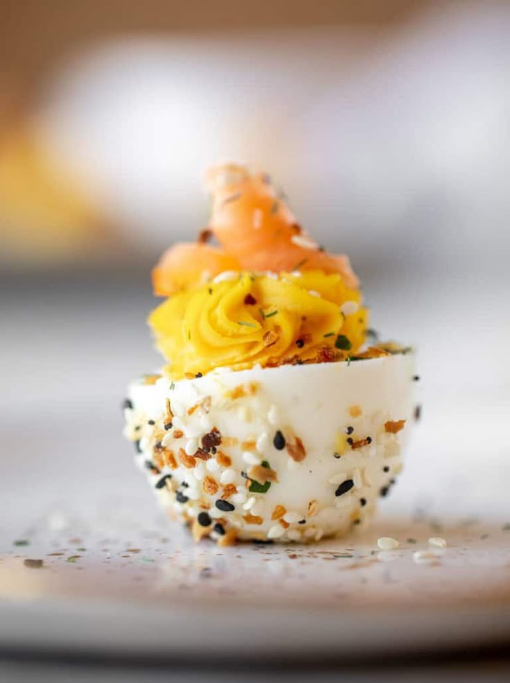 a small cup filled with food sitting on top of a table