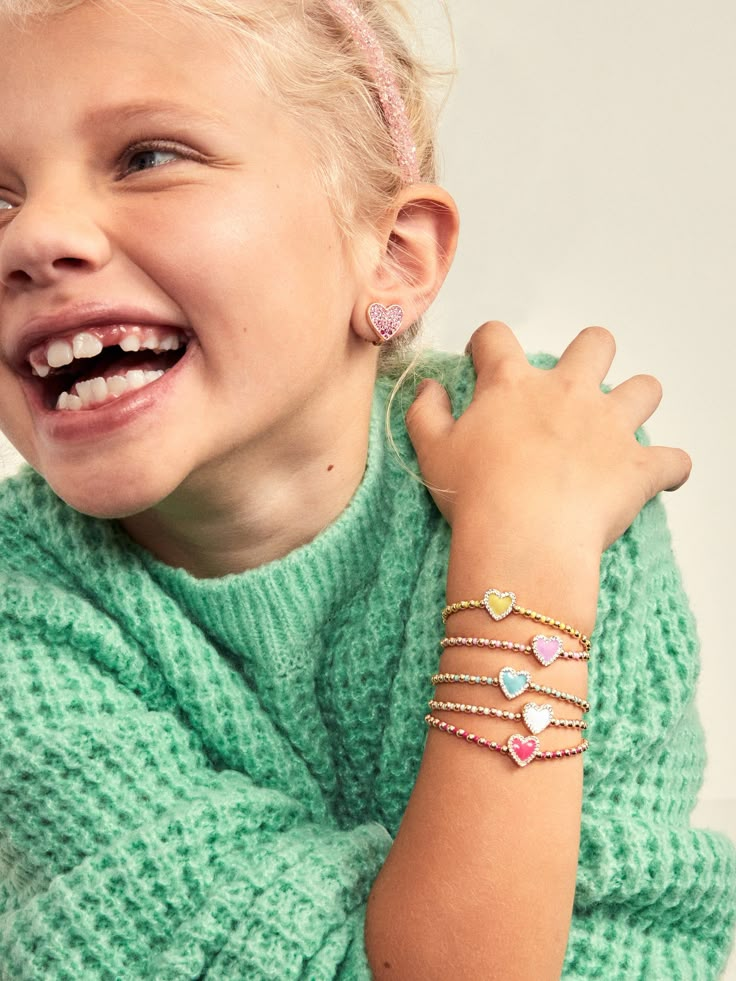 The Sweetheart Kids' Pisa Bracelet Set comes with five unique gold beaded bracelets. Each bracelet is complete with a heart bead in the center in a range of bright colors. Gift as a set to your little one, or split them apart to gift to them and all of their friends. READY TO GIFT: This item comes pre-packaged in a beautiful box.Please note: intended for children 3+ Playful Multicolor Heart-shaped Bracelets, Kids Necklace Gold, Kids Jewelry Gold, Bracelet Photography Ideas, Jewellery Box Ideas, Bracelet Photoshoot, Bracelets Photography, Bracelet Photography, Kid Jewelry