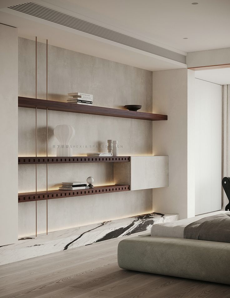 a bed sitting in a bedroom next to a wall mounted book shelf with books on it