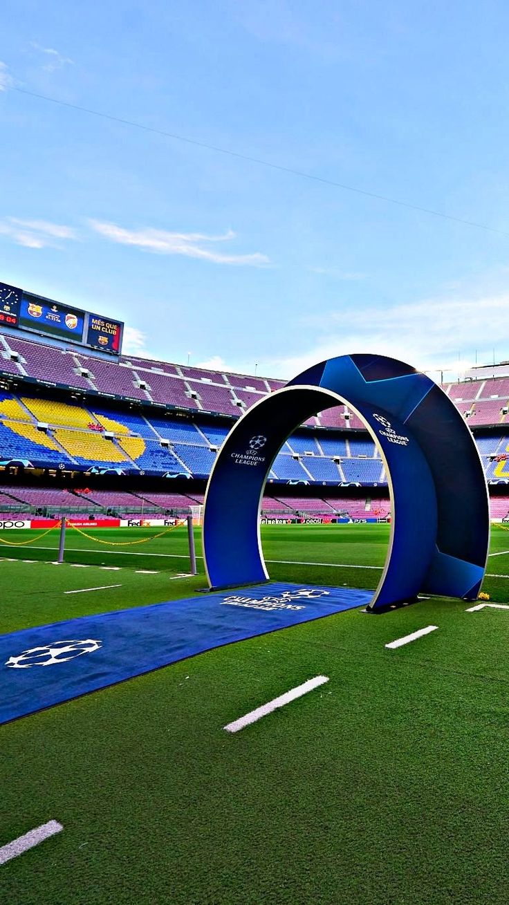 the inside of a football stadium with an arch