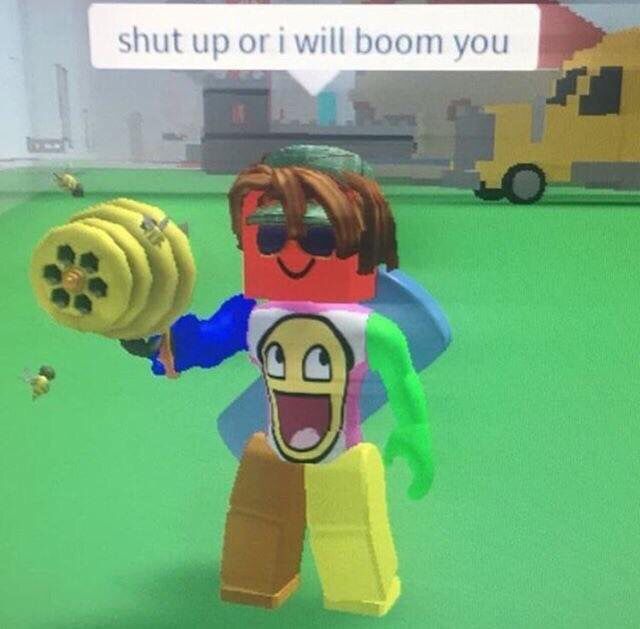 a cartoon character holding a banana in front of a computer screen with the words shut up or i will boom you