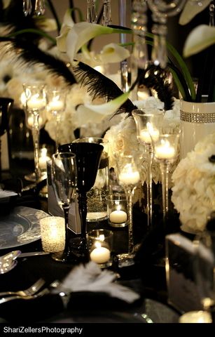 the table is set with candles and flowers