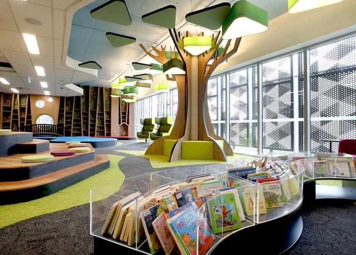 the children's library is equipped with books and seating for their own child to read