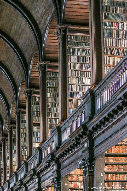 the inside of a library with many bookshelves filled with lots of book's