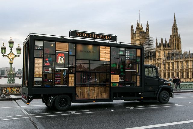 a food truck is parked on the side of the road in front of big ben