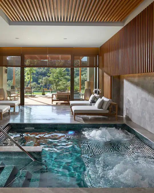 an indoor hot tub in the middle of a room