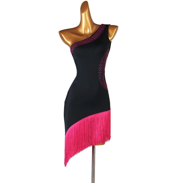 a mannequin wearing a black and pink dress with fringes on the skirt