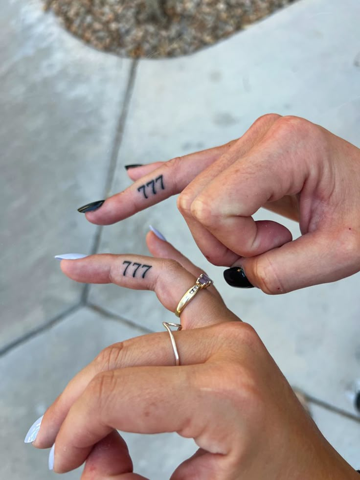 two people with matching rings on their fingers