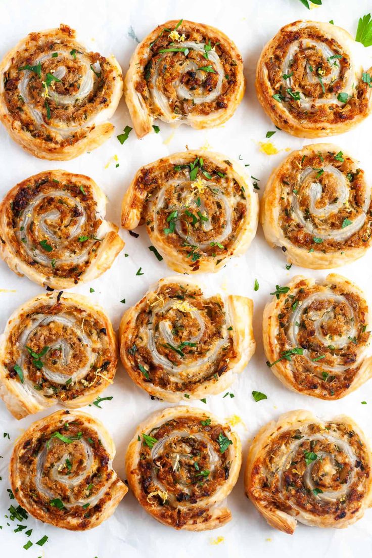 several rolls with different toppings on top of each one and garnished with parsley