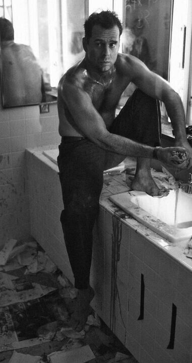 a man in the kitchen is washing his hands