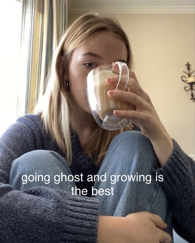 a woman sitting on the floor drinking out of a cup with a quote above her