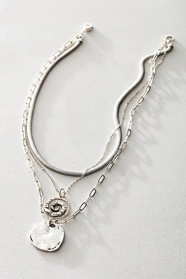 Add a little something extra with this stunning layered necklace featuring a mixture of three different chains accented by naturally-shaped, distressed charm details. * Clasp closure * Fixed length | Oversized Coin Necklace by Free People in Silver Layered Silver Necklace, Everyday Silver Necklace, Chunky Silver Jewellery Aesthetic, Boho Silver Jewelry, Cool Silver Jewelry, Stacked Silver Necklaces, Silver Chains Aesthetic, Stacked Necklaces Silver, Silver Stacked Necklaces